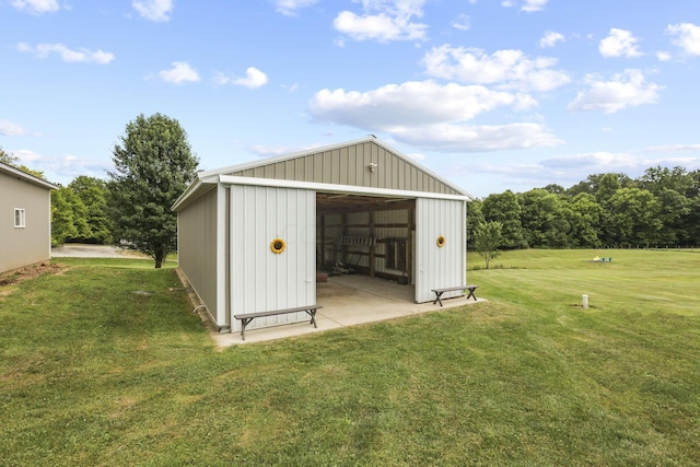 view of outdoor structure featuring a lawn