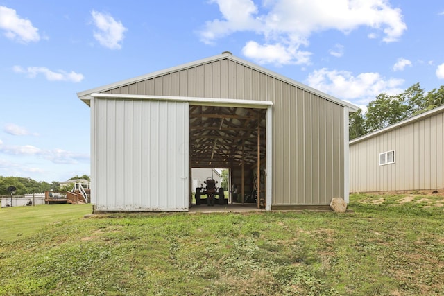 view of outdoor structure with a yard