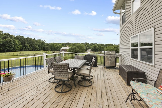 wooden terrace with area for grilling