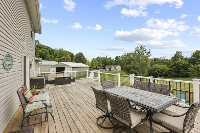 wooden terrace featuring an outdoor hangout area