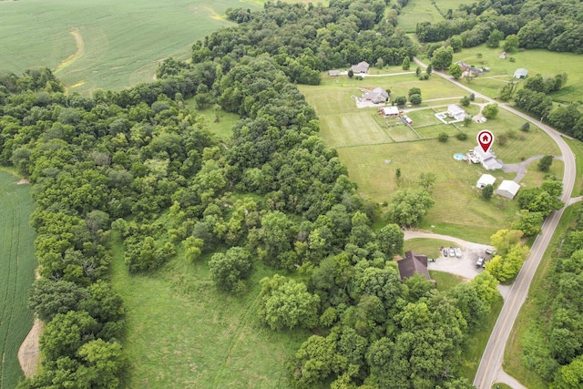 birds eye view of property with a rural view