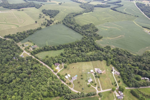 birds eye view of property featuring a rural view