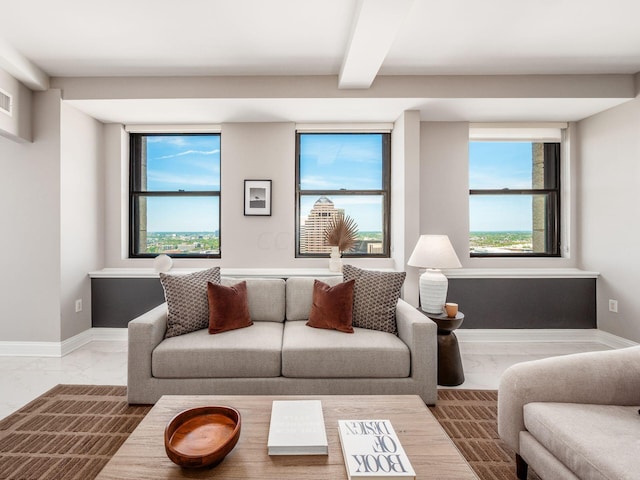 50 W Broad St Unit 2905, Columbus, OH 43215 - living area featuring marble finish floors, healthy amount of natural light, and beamed ceiling