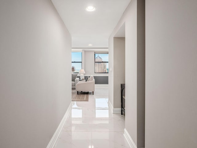50 W Broad St Unit 2905, Columbus, OH 43215 - hall featuring light marble finish flooring and recessed lighting