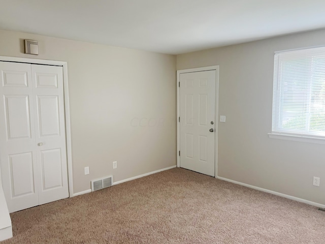 view of carpeted spare room