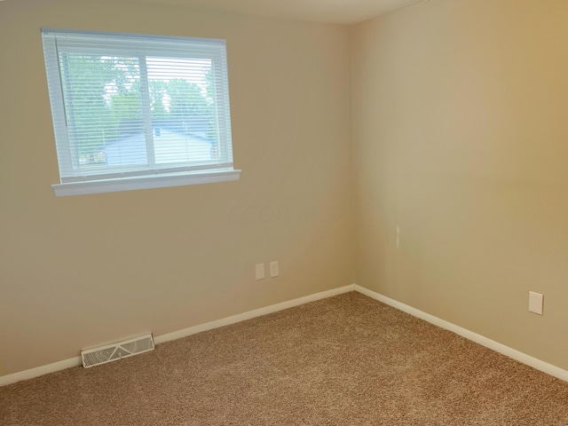 empty room with carpet flooring