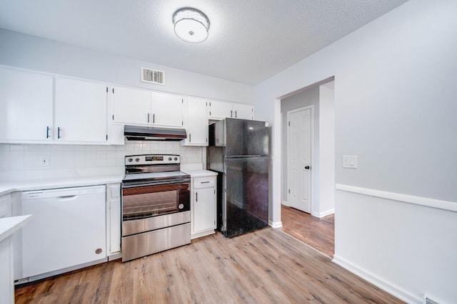 kitchen with stainless steel range with electric cooktop, white dishwasher, black fridge, light hardwood / wood-style flooring, and white cabinetry