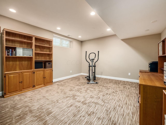 exercise room with light carpet