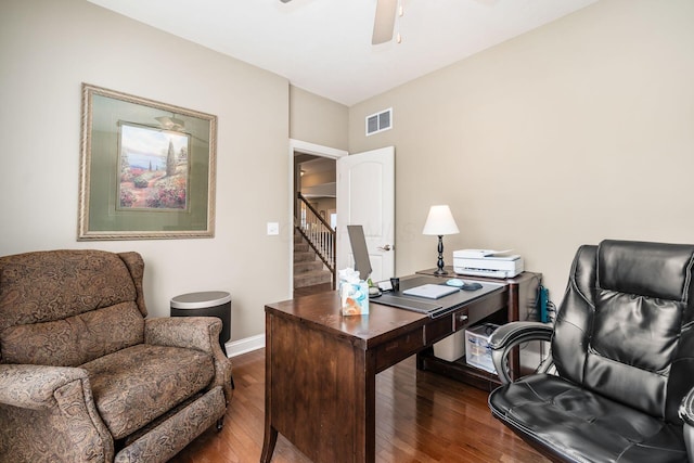 home office with ceiling fan and dark hardwood / wood-style floors