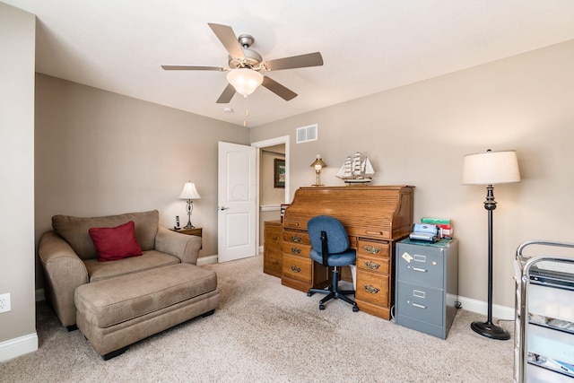 carpeted office featuring ceiling fan