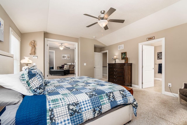 carpeted bedroom featuring ceiling fan and vaulted ceiling