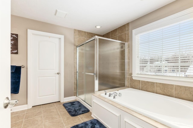 bathroom featuring tile patterned flooring and plus walk in shower