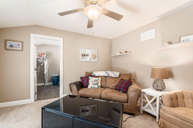 living room featuring light colored carpet, ceiling fan, and vaulted ceiling