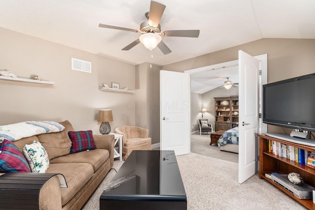 carpeted living room featuring vaulted ceiling