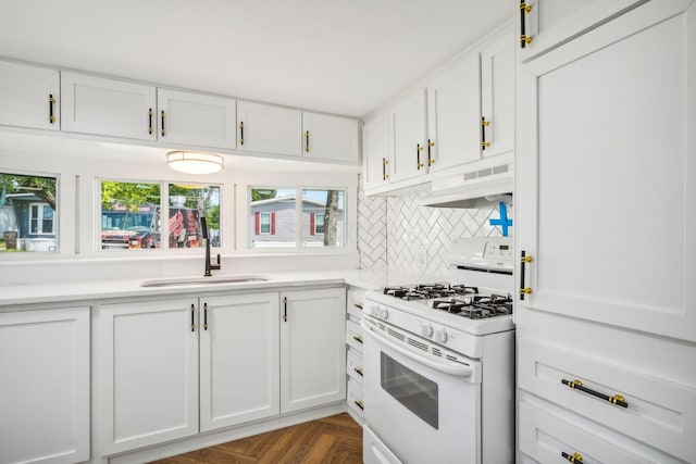 kitchen featuring white cabinets, white range with gas cooktop, and sink