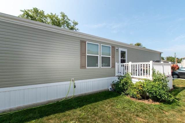 view of home's exterior featuring a yard