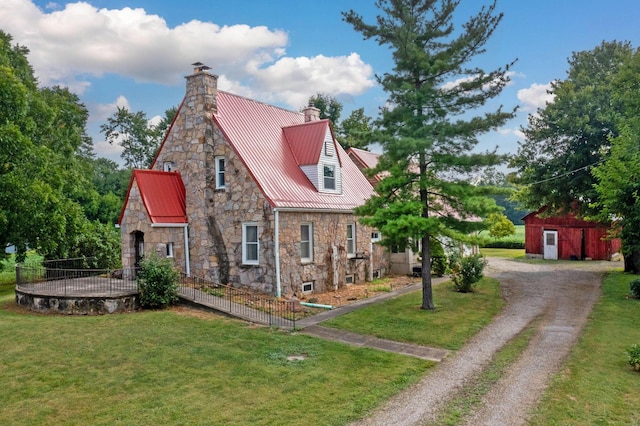 view of side of home featuring a yard