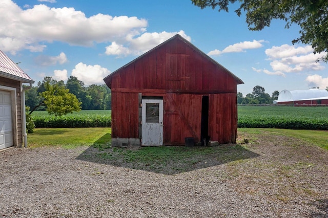 view of outbuilding with a yard