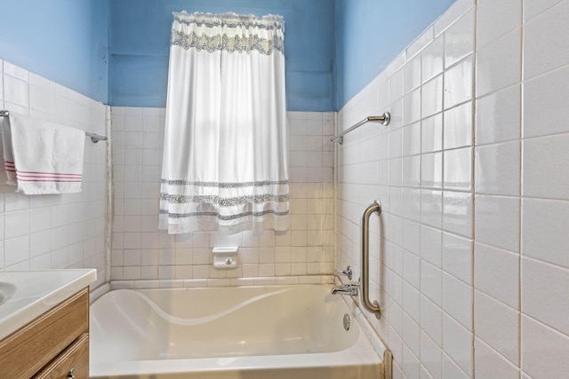 bathroom featuring vanity and a bath