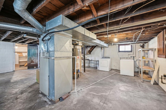 basement featuring gas water heater, separate washer and dryer, and heating unit