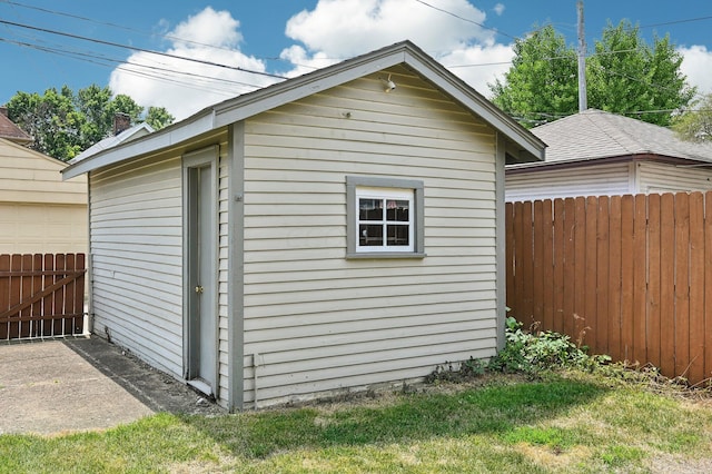 view of outbuilding featuring a lawn