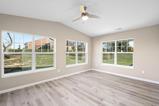 unfurnished room with vaulted ceiling, light hardwood / wood-style flooring, and ceiling fan