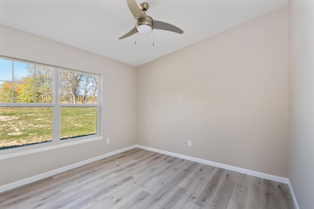 spare room with ceiling fan and light hardwood / wood-style floors