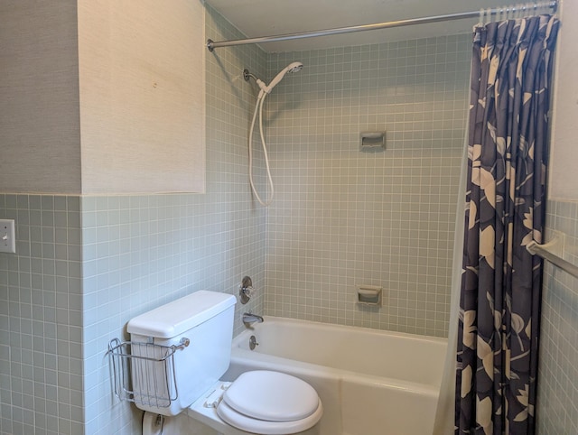 bathroom featuring shower / tub combo, toilet, and tile walls