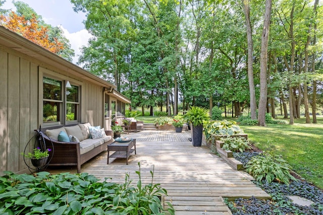 wooden terrace featuring outdoor lounge area and a yard