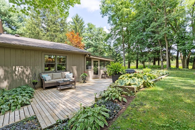 wooden terrace with a yard and an outdoor hangout area