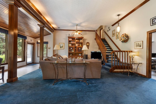 carpeted living room featuring crown molding, beamed ceiling, ceiling fan, and a textured ceiling