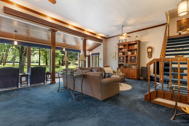 carpeted living room with ceiling fan, lofted ceiling, a textured ceiling, and ornamental molding