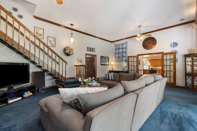 carpeted living room featuring ceiling fan, ornamental molding, a high ceiling, and french doors