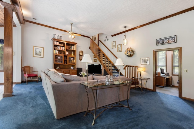 carpeted living room featuring ceiling fan, ornamental molding, and a textured ceiling