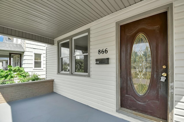 doorway to property featuring a porch