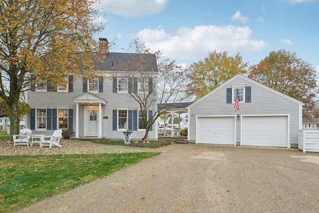 colonial-style house featuring a garage