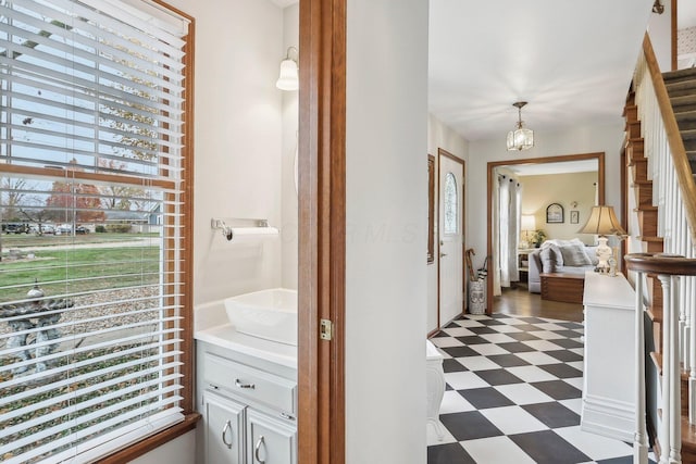 bathroom featuring a notable chandelier