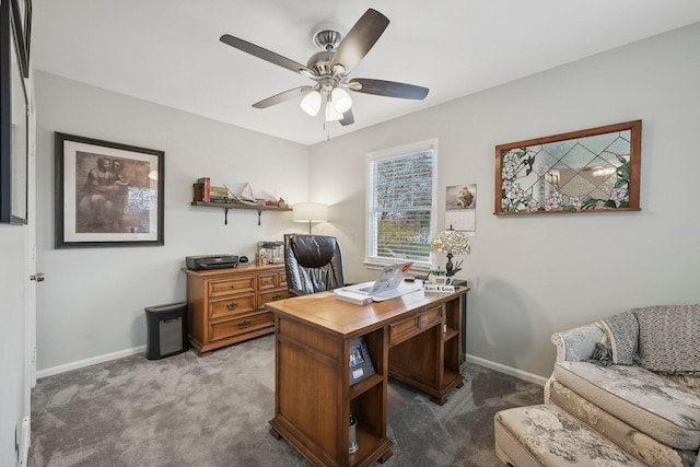 office with ceiling fan and dark carpet