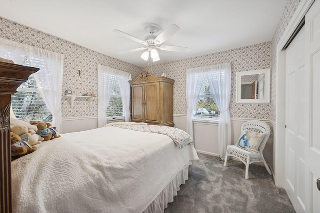 carpeted bedroom with a closet and ceiling fan