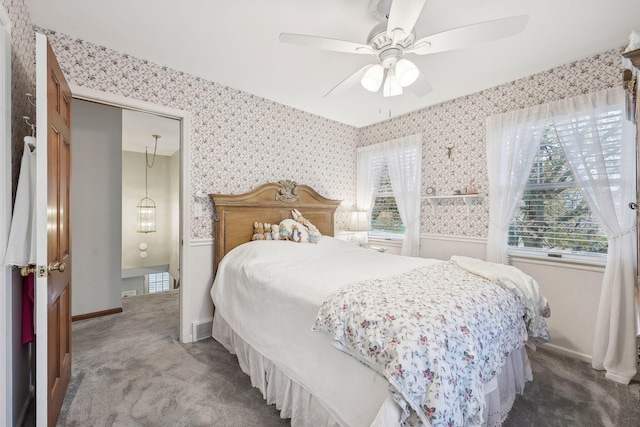 bedroom with dark colored carpet and ceiling fan