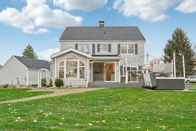 rear view of property with a yard