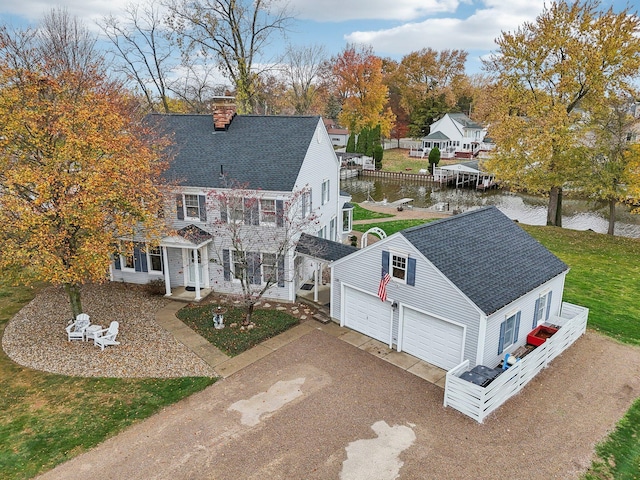 birds eye view of property with a water view