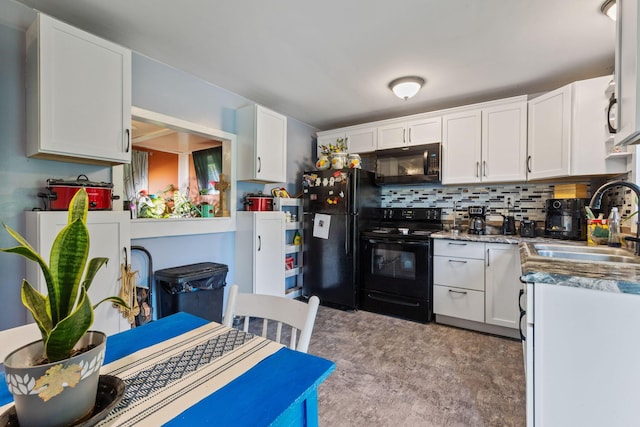 kitchen featuring decorative backsplash, sink, white cabinets, and black appliances