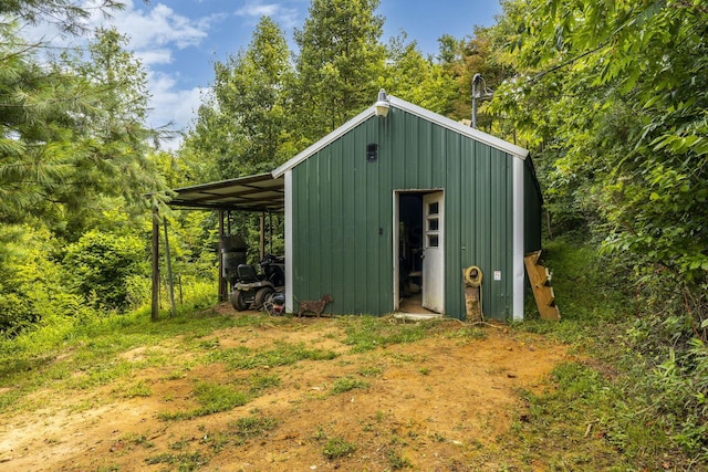 view of outbuilding featuring a carport