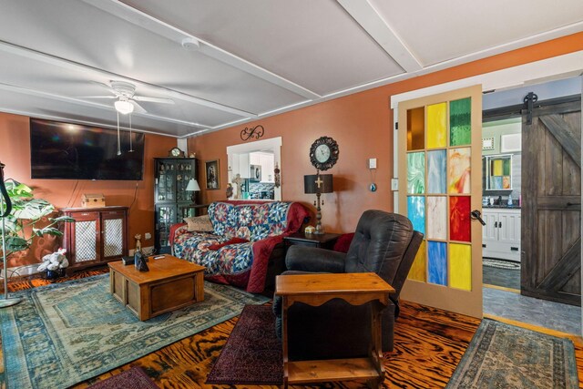 13207 Clapper Hollow Rd, Rockbridge, OH 43149 - living room with a barn door, ceiling fan, and wood finished floors