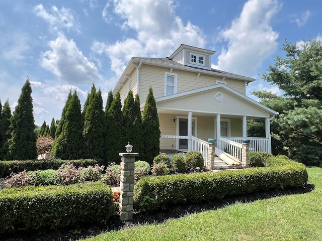 view of front of property featuring covered porch