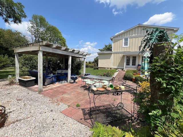 view of patio / terrace with a pergola, an outdoor hangout area, and french doors