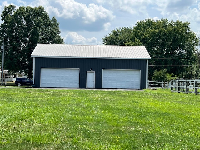 garage with a yard