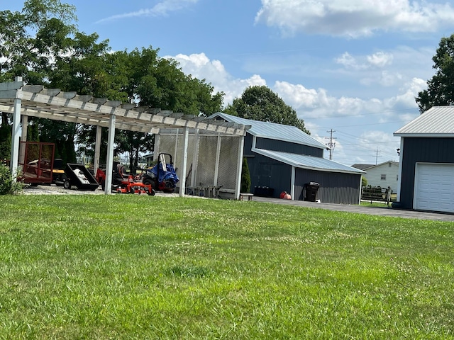 view of outdoor structure with a garage, a pergola, and a yard