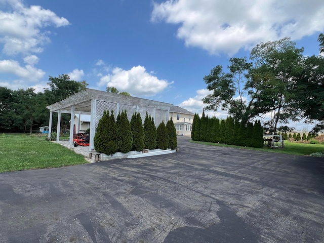 view of property's community with a pergola and a yard